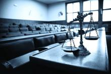 the scales of justice in a courtroom are shown