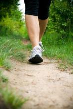 woman walking along a trail