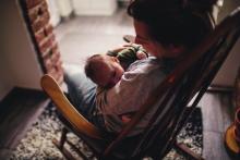 Mother in rocking chair with baby