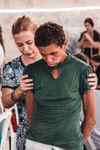 A health professional assists a patient during a medical visit in San Luis, Maracaibo, by the nongovernmental organization Primeros Auxilios LUZ.