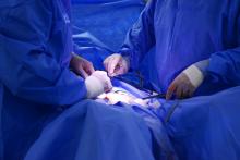 U.S. Air Force Maj. Arthur Greenwood and Capt. Stuart Winkler, 633rd Surgical Operations Squadron obstetricians, use a 3-D scope and glasses while performing a laparoscopic hysterectomy at Langley Air Force Base, Va., June 14, 2016