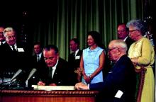 President Lyndon B. Johnson signed the Medicare bill on July 30, 1965.