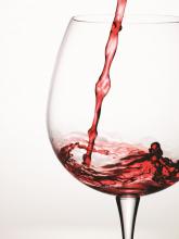 red wine pouring into wine glass