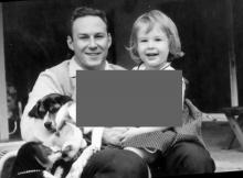 Dr. Edward Ross Ritvo shares a light moment with his daughter, Eva, and their dogs, circa 1963.