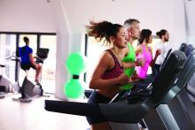 Adults using treadmills