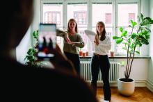 Girls dancing, being recorded on phone