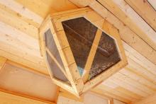 A screened box with a hive allows Airbnb guests to sleep to the sound and scent of bees.