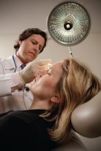 Doctor with patient during botox procedure.