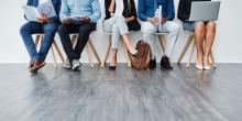 Group of diverse businesspeople sitting in chairs