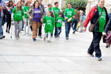 Adults and children participate in a fundraising walk.