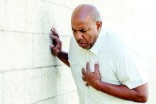 Man clutching chest for chest pain