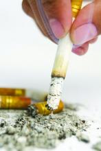 Cigarette snuffed out amid cigarette butts