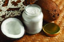Coconut oil in a jar and half a coconut