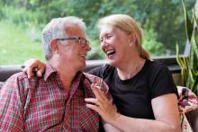 Senior retired couple enjoying marijuana in their gazebo garden