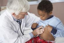 Doctor using stethoscope on a child.