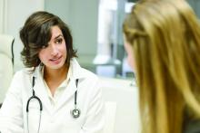 A doctor talking to her patient.