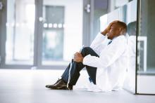 stressed doctor sitting down