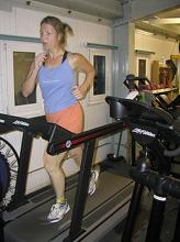 A woman uses a treadmill