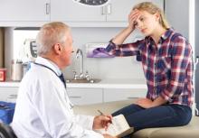 A teenage girl vists a doctor for a headache.