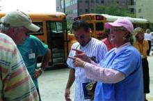 Karen Sexton, RN, PhD, UTMB's incident commander during Hurricane Rita, discusses evacuation options with her employees.