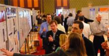 Attendees look over the 195 posters presented April 3.