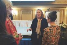 Dr. Holly G. Atkinson speaks to audience members after her presentation at the American Medical Women's Asociation annual meeting.