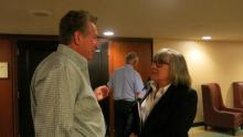 Health law attorney Elizabeth Snelson speaks with an audience member after her presentation at an American Bar Association meeting.