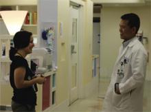 Dr. Chang (right) chats with a colleague at Rady Children’s Hospital in San Diego.