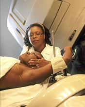 Therapist preparing patient to receive radiation Photo by Rhoda Baer