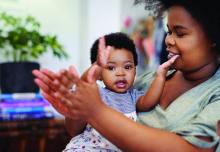 Mother and child clapping