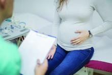 Doctor and pregnant woman in consultation.