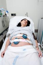 Pregnant woman in a hospital bed