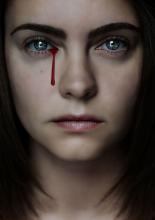 woman with a bloody tear