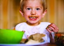 toddler eating peanut butter