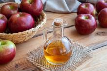 apples and apple vinegar on a table