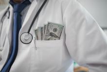 lab coat with money in pocket