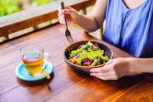 Woman eating quinoa salad